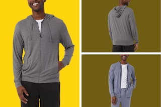 A man wears a grey zip-up