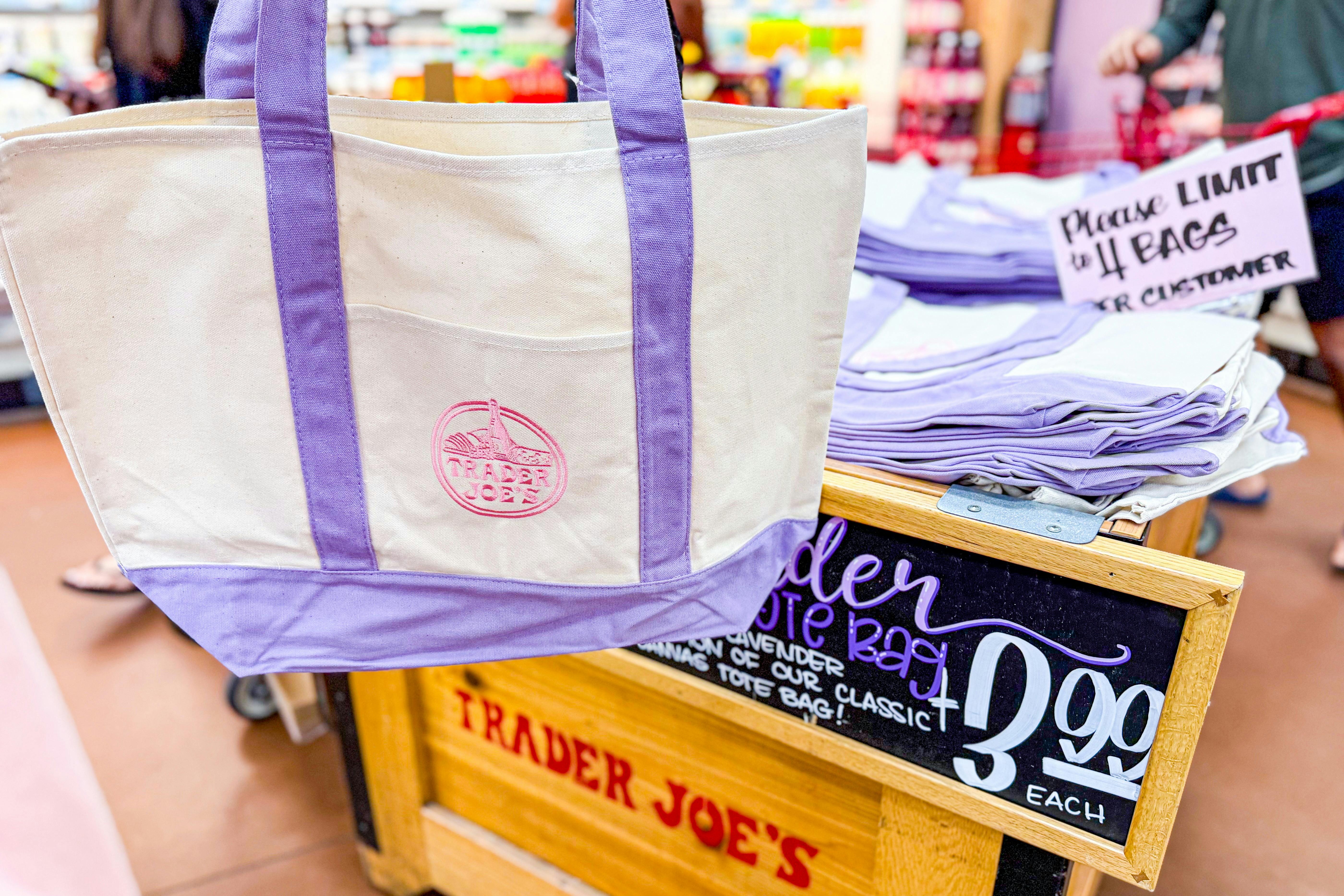 trader joes purple canvas tote bag and stocked store bin