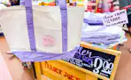 trader joes purple canvas tote bag and stocked store bin
