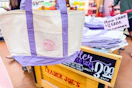 trader joes purple canvas tote bag and stocked store bin