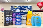 axe body wash, cottonelle toilet paper, crest toothpaste, arm and hammer detergent, and ogx shampoo on a shelf