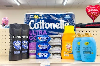 axe body wash, cottonelle toilet paper, crest toothpaste, arm and hammer detergent, and ogx shampoo on a shelf