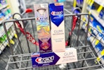 crest brilliance and gum toothpaste in a cart