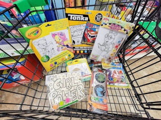 a cart with a bunch of kids painting projects in it