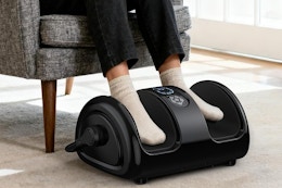 a woman using a foot massager