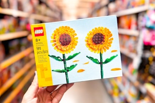 Lego Sunflower Buildable Floral Display held up in center os toy isle in Walmart
