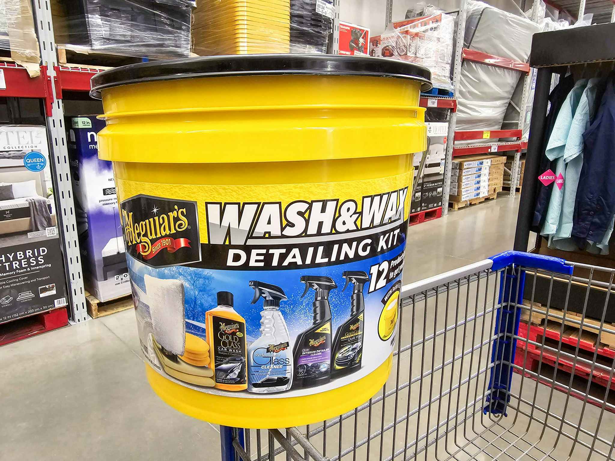 car detailing kit in a bucket on a shopping cart