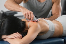 massage tool being used on back