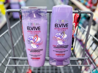 two bottles of L'Oreal Elvive shampoo and conditioner inside shopping cart