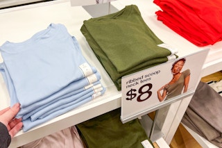 women's tops sitting on a shelf at target