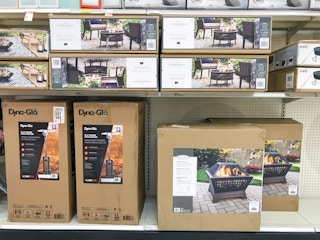 patio heaters and fire pits on a shelf at target