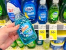 hand holding gain small dish soap next to sale tags