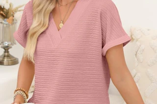 a woman wearing a textured top