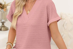 a woman wearing a textured top