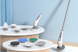 Electric Spin Scrubber, 10 in 1 Airpher Cordless Cleaning Brush set against a wall.