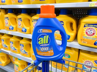 bottle of all oxi liquid laundry detergent on the corner of a walmart cart
