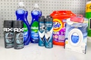 axe body spray, palmolive dish soap, degree deodorant, tide pods, and febreze air freshener on a shelf