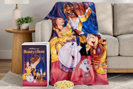 Disney VHS blanket on a couch