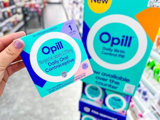 hand holding opill birth control