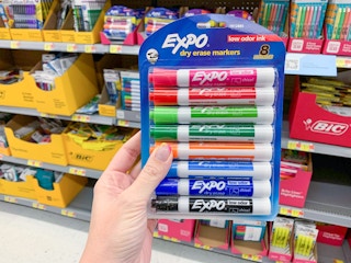 expo dry erase chisel tip markers held in front of walmart shelves