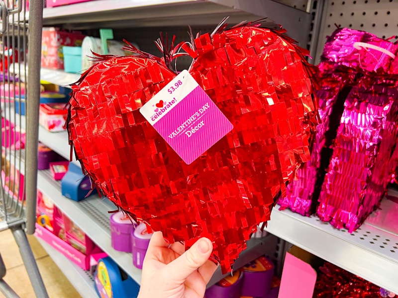 hand holding heart pinata at walmart