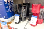 two keurig k-essentials coffee makers on walmart shelf