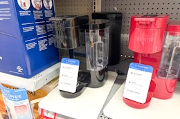 two keurig k-essentials coffee makers on walmart shelf