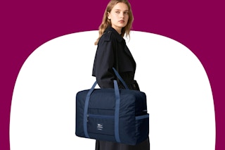 Model wearing a blue weekender bag
