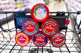old spice hair pomades in a triangle in a cart