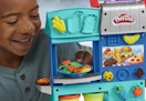 child playing with the Playdoh Kitchen creations set
