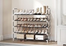 a shoe rack with shoes against a wall