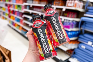 hand holding 2 bottles of bodyarmor sports drinks at target