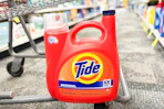 jumbo tide detergent bottle on the bottom of a cvs cart