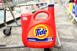 jumbo tide detergent bottle on the bottom of a cvs cart