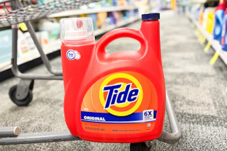 jumbo tide detergent bottle on the bottom of a cvs cart