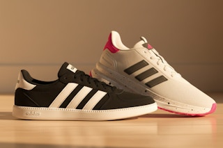 Adidas women's shoes next to each other on floor