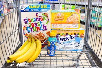 cinnamon toast crunch, bananas, capri sun, oscar mayer, welch's in a shopping cart