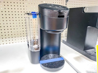 Instant coffee maker on display shelf