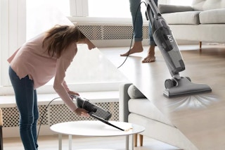 someone using a 3-in-1 vacuum