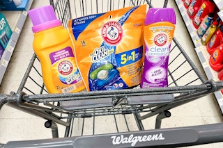 shopping cart with one bottle of Arm & Hammer laundry detergent, Power Paks, and Clean Scentsations inside