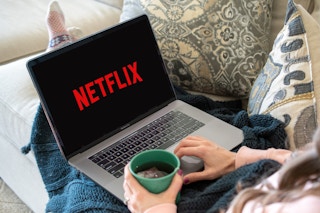 someone opening up netflix on their laptop