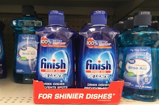 bottles of finish jet dry rinse aid in a red cardboard box on a walmart shelf