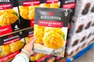 hand holding a box of red lobster cheddar bay biscuit mix