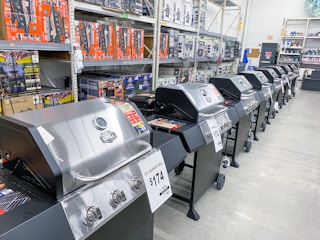 stainless steel grills lined up in Walmart's outdoor section