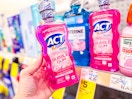 hand holding act kids mouthwash in cvs