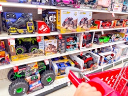 target cart parked in front of monster jam toys sitting on a target shelf