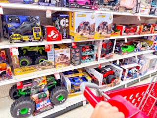 target cart parked in front of monster jam toys sitting on a target shelf