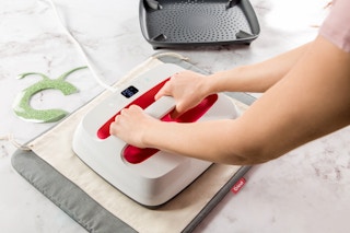 stock photo of cricut easypress2 being used on small piece of fabric