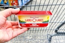 hand holding a tub of land o lakes butter