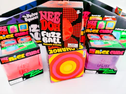 assortment of boxes containing needoh